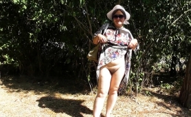 naughty-mature-lady-flashes-her-hairy-beaver-in-the-outdoors