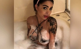 Tattooed Brunette Showing Off Her Big Boobs In The Bathtub
