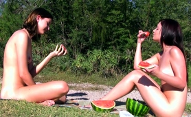 naked-teens-enjoying-the-sun-and-eating-watermelon-outdoors
